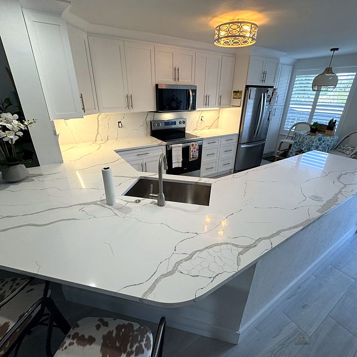 Finished kitchen with veined stone countertop