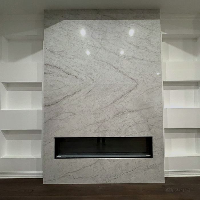 Fireplace wall clad in full-height stone